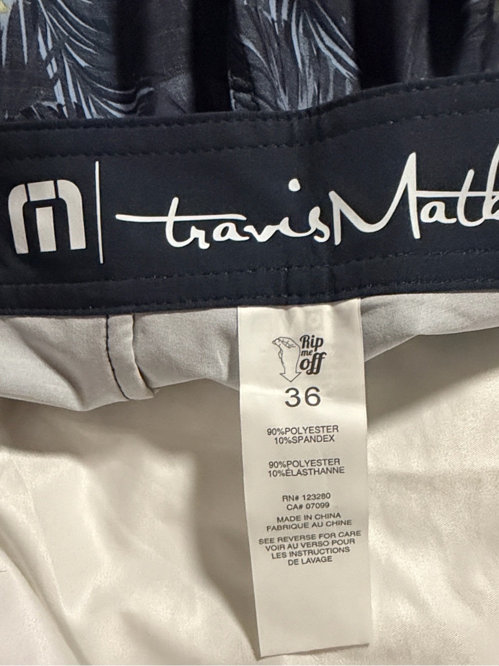 Travis Mathew Navy Floral Swim Board Shorts with Yellow Accents - Picture 7 of 7